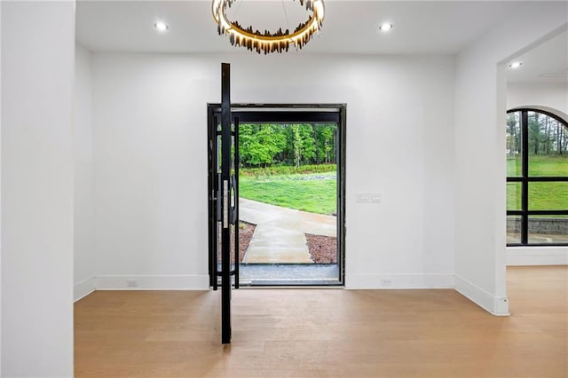 15154 Hopewell Rd, Alpharetta, GA 30004 - entryway with wood finished floors, a chandelier, baseboards, and recessed lighting