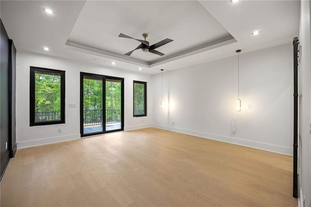 15154 Hopewell Rd, Alpharetta, GA 30004 - spare room featuring a raised ceiling, light wood finished floors, baseboards, healthy amount of natural light, and recessed lighting