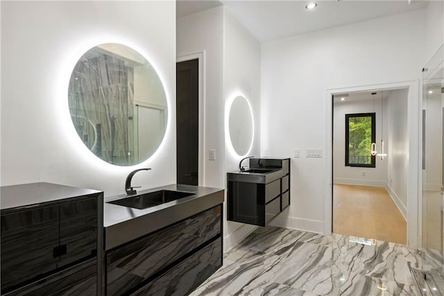 15154 Hopewell Rd, Alpharetta, GA 30004 - full bath featuring two vanities, baseboards, and marble finish floors