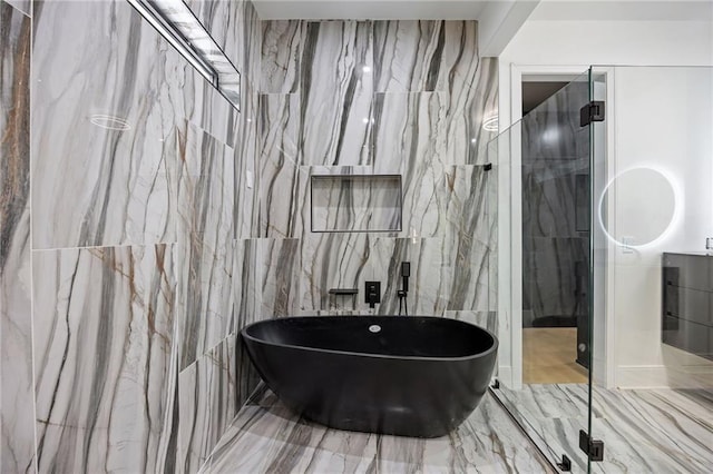 15154 Hopewell Rd, Alpharetta, GA 30004 - bathroom featuring a freestanding tub, tile walls, and a marble finish shower