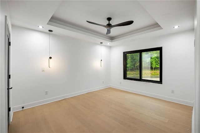 15154 Hopewell Rd, Alpharetta, GA 30004 - empty room with a raised ceiling, light wood-style floors, a ceiling fan, baseboards, and recessed lighting