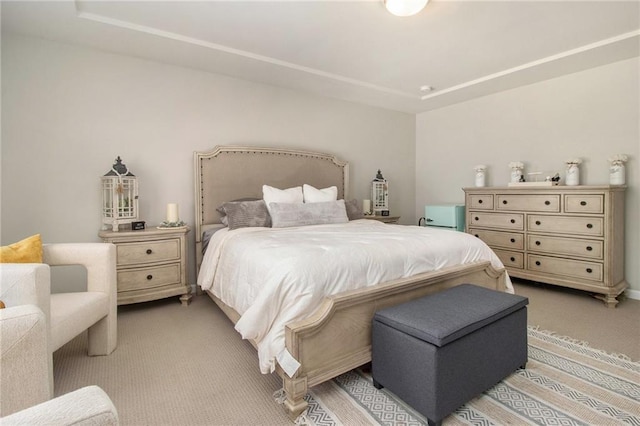 bedroom with light colored carpet