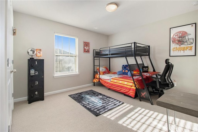 bedroom featuring light colored carpet