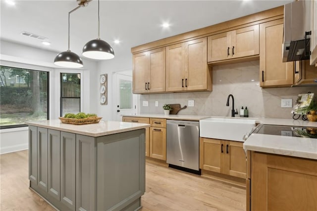 9165 Eves Cir, Roswell, GA 30076 - kitchen featuring stainless steel dishwasher, tasteful backsplash, light wood-type flooring, a center island, and decorative light fixtures
