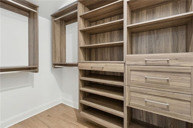 9165 Eves Cir, Roswell, GA 30076 - spacious closet featuring wood finished floors