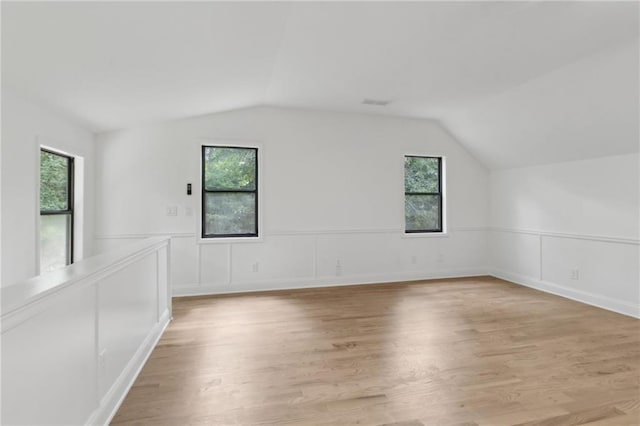 9165 Eves Cir, Roswell, GA 30076 - additional living space with lofted ceiling, light wood-type flooring, and a wainscoted wall