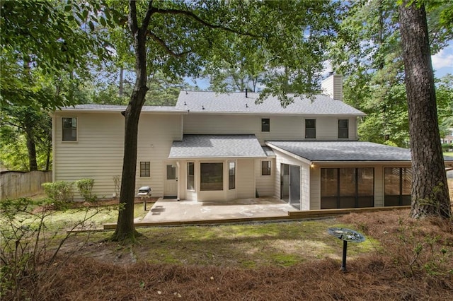 9165 Eves Cir, Roswell, GA 30076 - back of property featuring a patio area, a chimney, and a sunroom