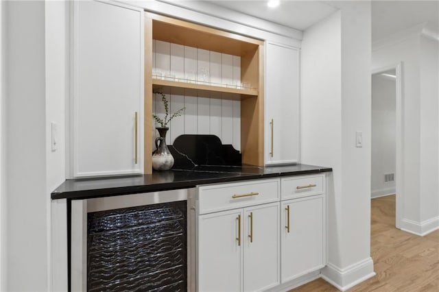 9165 Eves Cir, Roswell, GA 30076 - indoor dry bar featuring beverage cooler and light wood-style floors