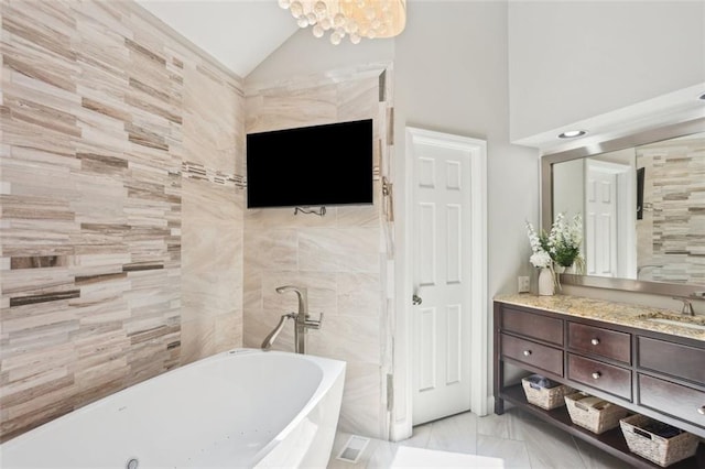 3837 Fenway Xing, Marietta, GA 30062 - full bath with a freestanding tub, lofted ceiling, marble finish flooring, and vanity
