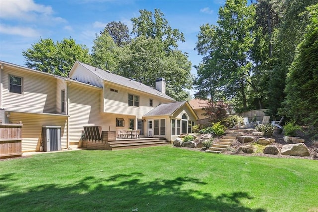3837 Fenway Xing, Marietta, GA 30062 - back of property with a wooden deck, a chimney, and a yard