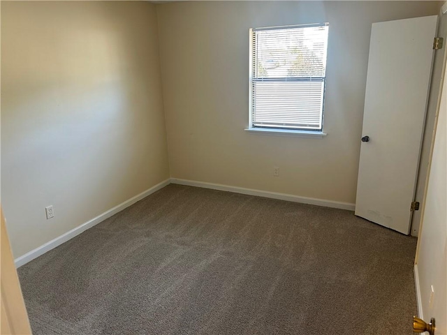 unfurnished room with carpet flooring