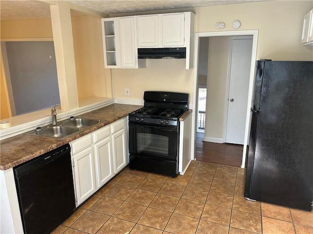 kitchen with white cabinets, kitchen peninsula, and black appliances