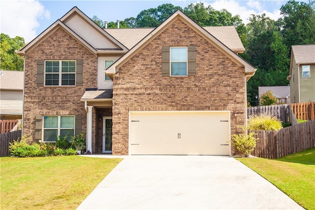 view of front of home with a front lawn and a garage