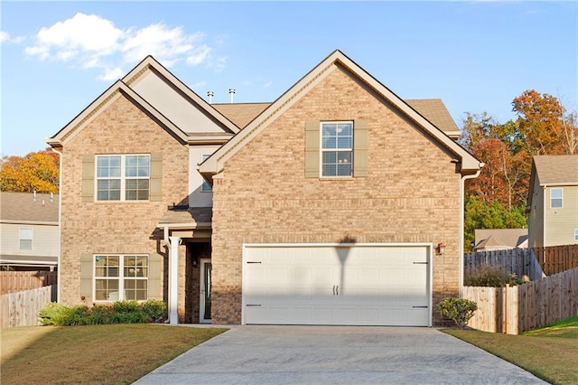 front of property with a garage and a front lawn