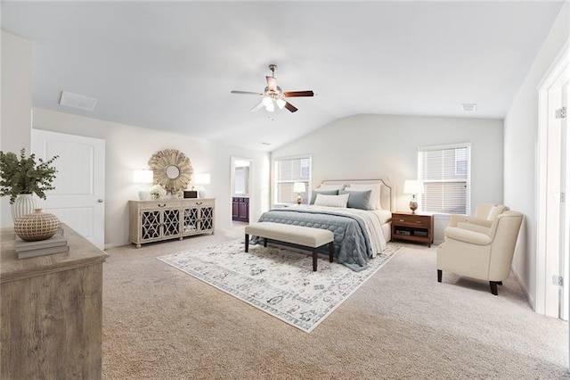 carpeted bedroom with ceiling fan and vaulted ceiling