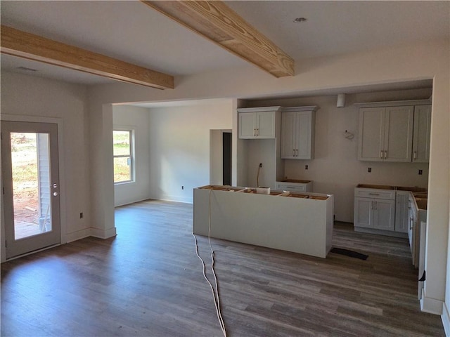 34 Hawkins Rd, Taylorsville, GA 30178 - kitchen featuring wood finished floors, beamed ceiling, baseboards, a center island, and white cabinets