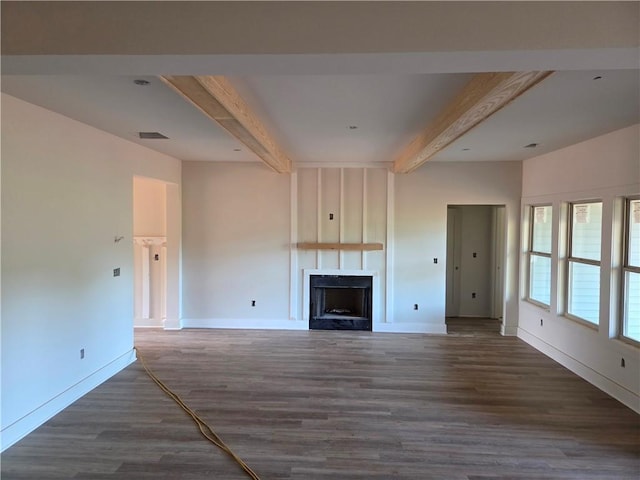 34 Hawkins Rd, Taylorsville, GA 30178 - unfurnished living room featuring beam ceiling, a large fireplace, baseboards, and wood finished floors