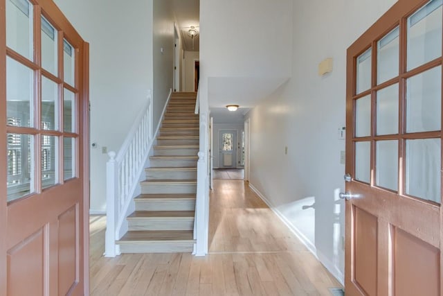 entryway featuring a healthy amount of sunlight and light hardwood / wood-style floors