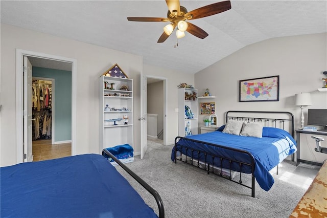 80 Riley Place Dr, Dawsonville, GA 30534 - carpeted bedroom featuring lofted ceiling, a textured ceiling, a ceiling fan, and a spacious closet