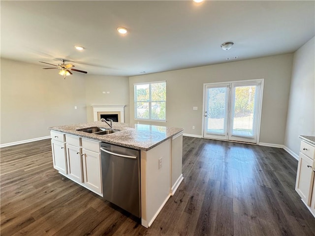 kitchen featuring dishwasher, a center island with sink, sink, white cabinets, and dark hardwood / wood-style flooring