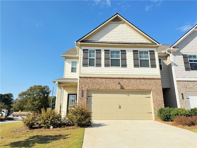 view of front facade with a front yard and a garage