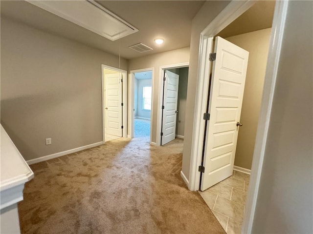 hallway featuring light carpet