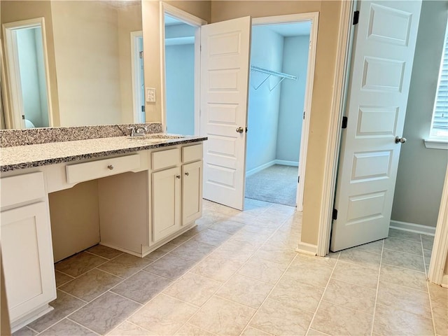 bathroom with vanity and tile patterned flooring