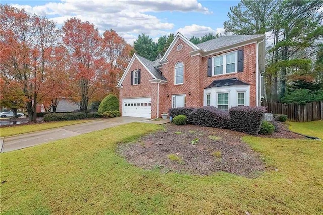 front of property with a garage and a front lawn