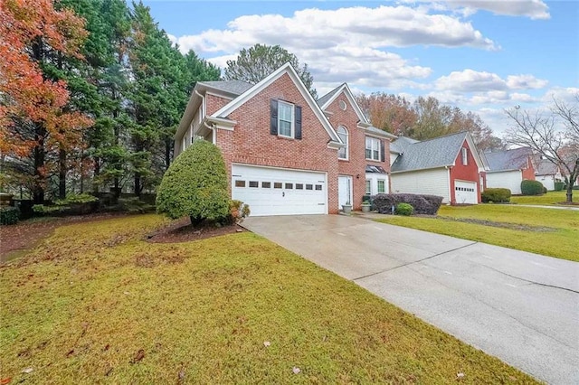 view of front property with a garage and a front lawn