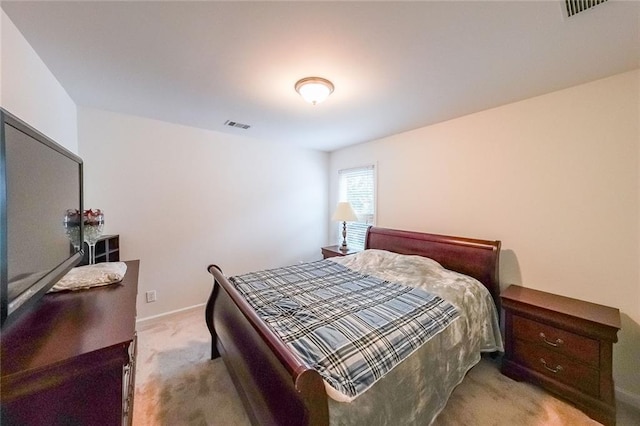 bedroom with light colored carpet