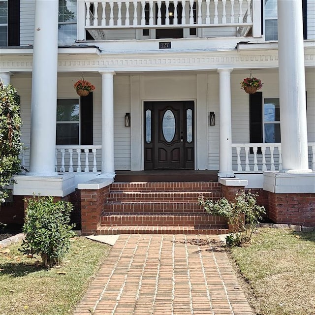 doorway to property with covered porch