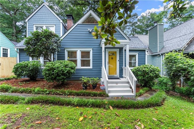 233 Spence Ave SE, Atlanta, GA 30317 - bungalow-style home featuring roof with shingles and a chimney