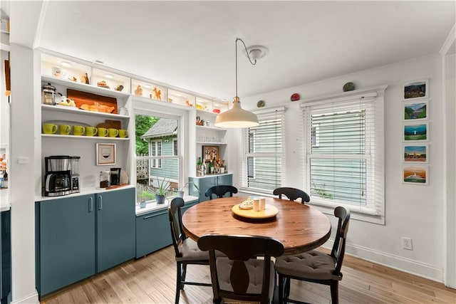 233 Spence Ave SE, Atlanta, GA 30317 - dining space featuring light wood-type flooring, ornamental molding, and baseboards