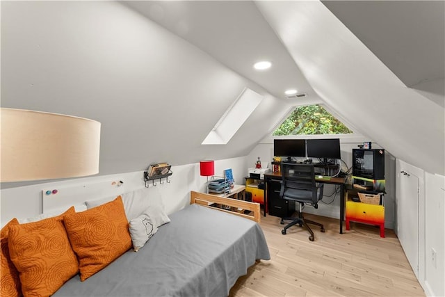 233 Spence Ave SE, Atlanta, GA 30317 - bedroom with wood finished floors, a skylight, lofted ceiling, and recessed lighting