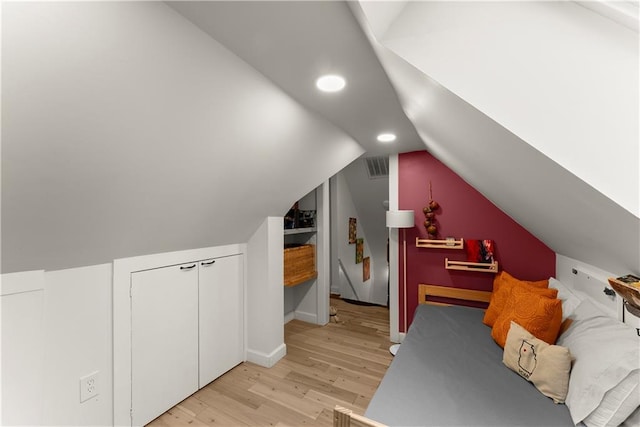 233 Spence Ave SE, Atlanta, GA 30317 - bedroom featuring light wood-style floors, vaulted ceiling, recessed lighting, baseboards, and a closet