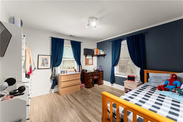 233 Spence Ave SE, Atlanta, GA 30317 - bedroom featuring baseboards, light wood-style flooring, and crown molding