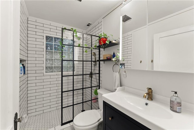 233 Spence Ave SE, Atlanta, GA 30317 - bathroom with toilet, a tile shower, and vanity