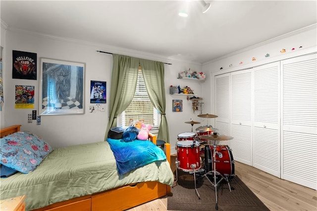 233 Spence Ave SE, Atlanta, GA 30317 - bedroom with wood finished floors, crown molding, and a closet