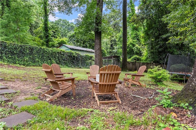 233 Spence Ave SE, Atlanta, GA 30317 - fenced yard with a fire pit and a trampoline