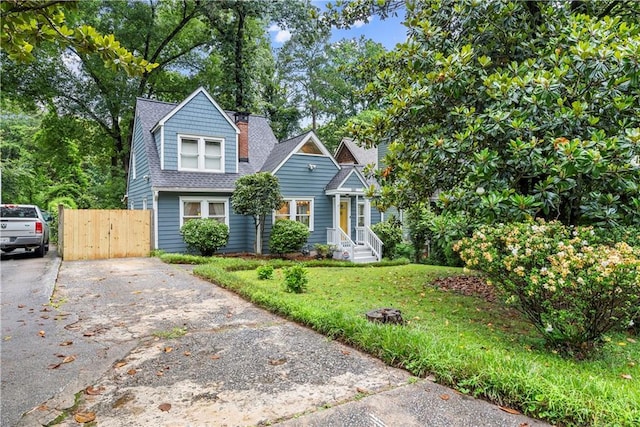 233 Spence Ave SE, Atlanta, GA 30317 - view of front of house with driveway and roof with shingles