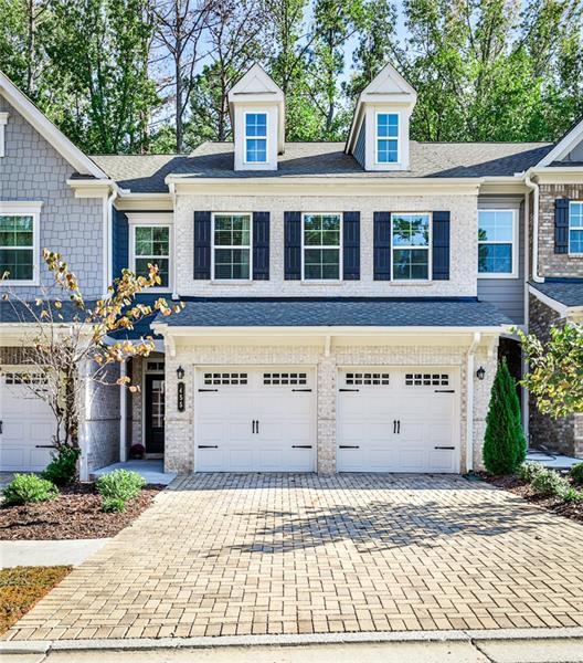 townhome / multi-family property featuring a garage