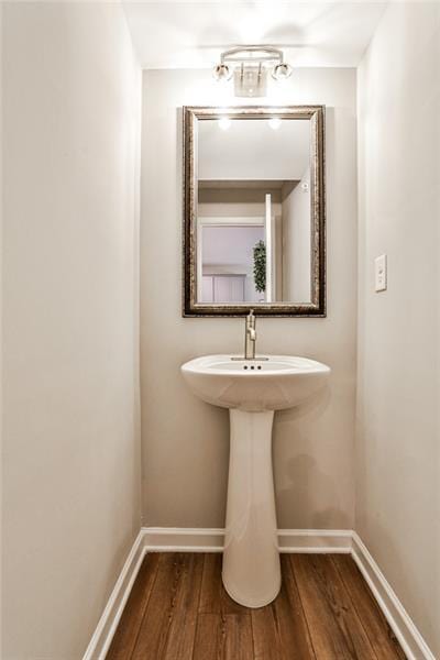 bathroom with hardwood / wood-style flooring