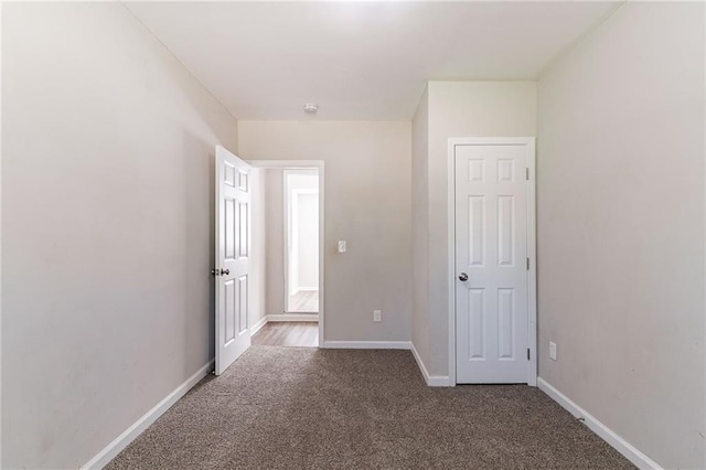 unfurnished bedroom with carpet floors