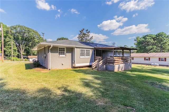 rear view of house with a lawn