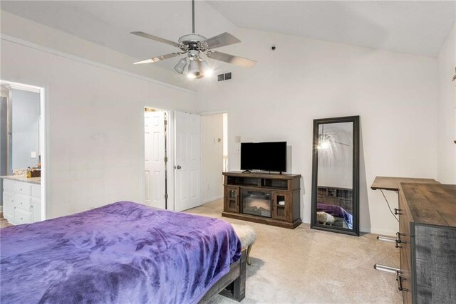 7275 Oswego Trl, Riverdale, GA 30296 - bedroom with light carpet, ensuite bath, vaulted ceiling, and visible vents