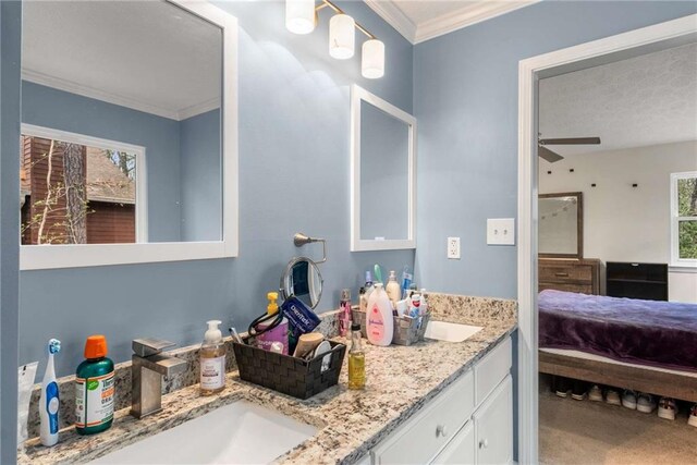 7275 Oswego Trl, Riverdale, GA 30296 - bathroom with double vanity, ornamental molding, ensuite bathroom, ceiling fan, and a sink