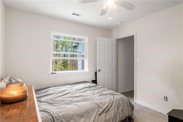 7275 Oswego Trl, Riverdale, GA 30296 - bedroom featuring carpet flooring, visible vents, baseboards, and a ceiling fan