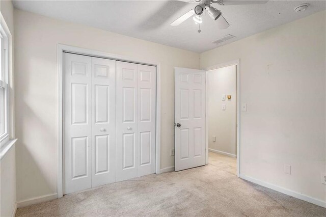7275 Oswego Trl, Riverdale, GA 30296 - unfurnished bedroom featuring a closet, visible vents, baseboards, and carpet