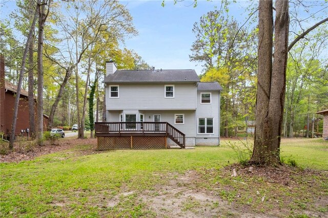 7275 Oswego Trl, Riverdale, GA 30296 - rear view of property with a chimney, a deck, and a lawn