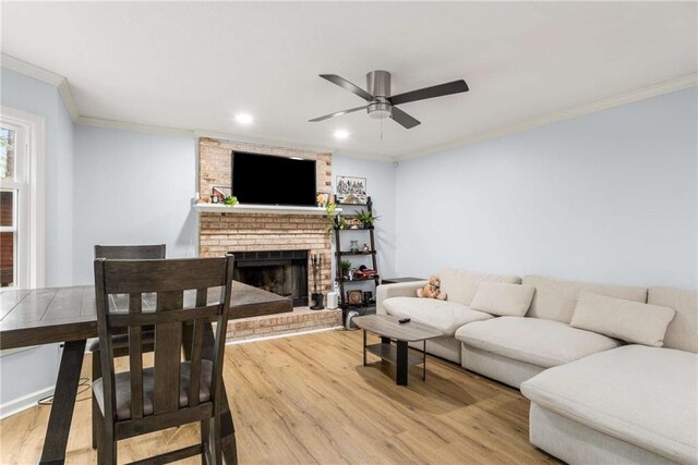 7275 Oswego Trl, Riverdale, GA 30296 - living room with ornamental molding, a brick fireplace, ceiling fan, and wood finished floors